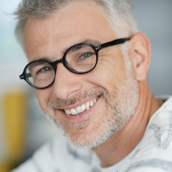 handsome confident mature man wearing glasses