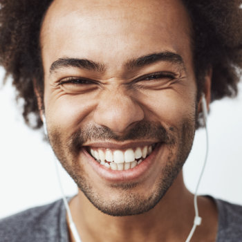 laughing african american listening to music