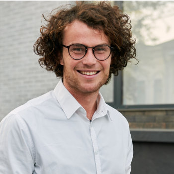 man in glasses with a healthy smile