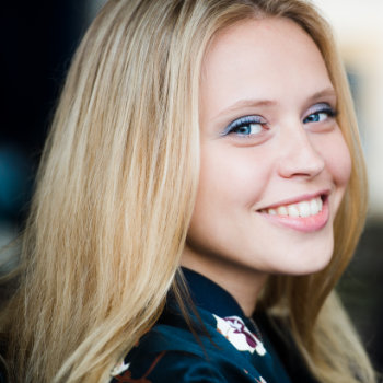 smiling blonde woman with a healthy smile