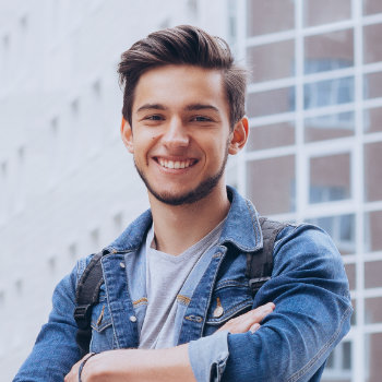 young confident man smiling happily
